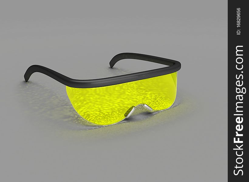 Yellow science glasses with some caustics over gray surface. Yellow science glasses with some caustics over gray surface