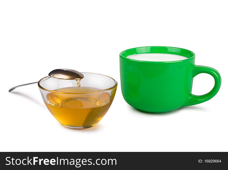 Cup of honey and milk cup on a white background. Cup of honey and milk cup on a white background