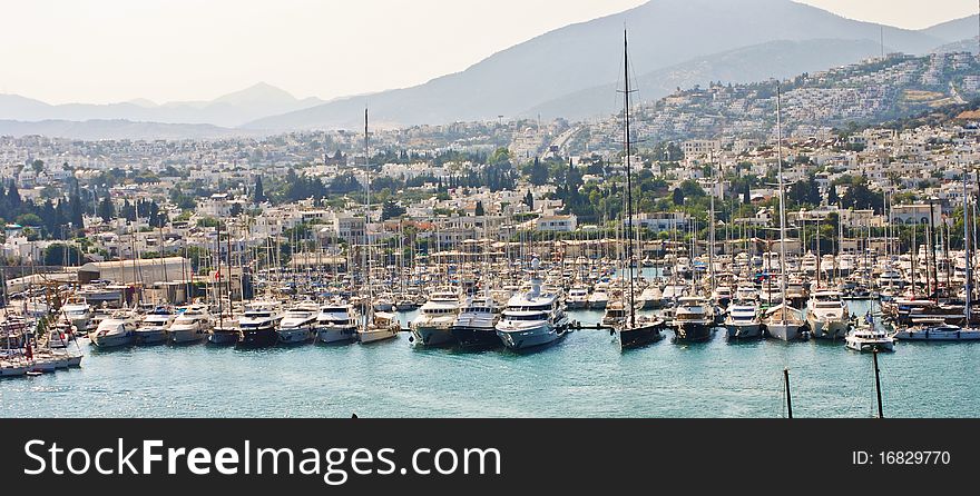 Small harbor with luxury sailboats, motorboats and yachts. Small harbor with luxury sailboats, motorboats and yachts