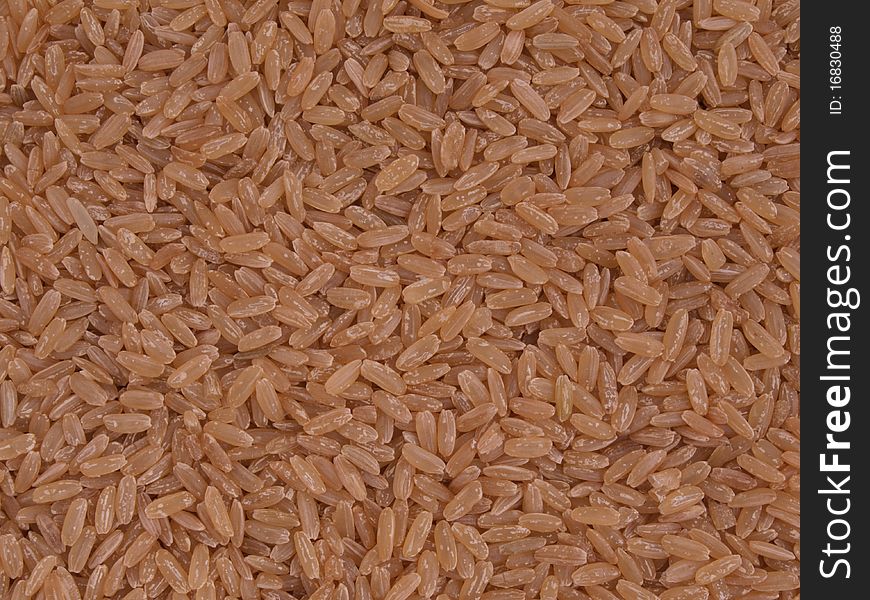 Brown, long grain rice with no background. Brown, long grain rice with no background.