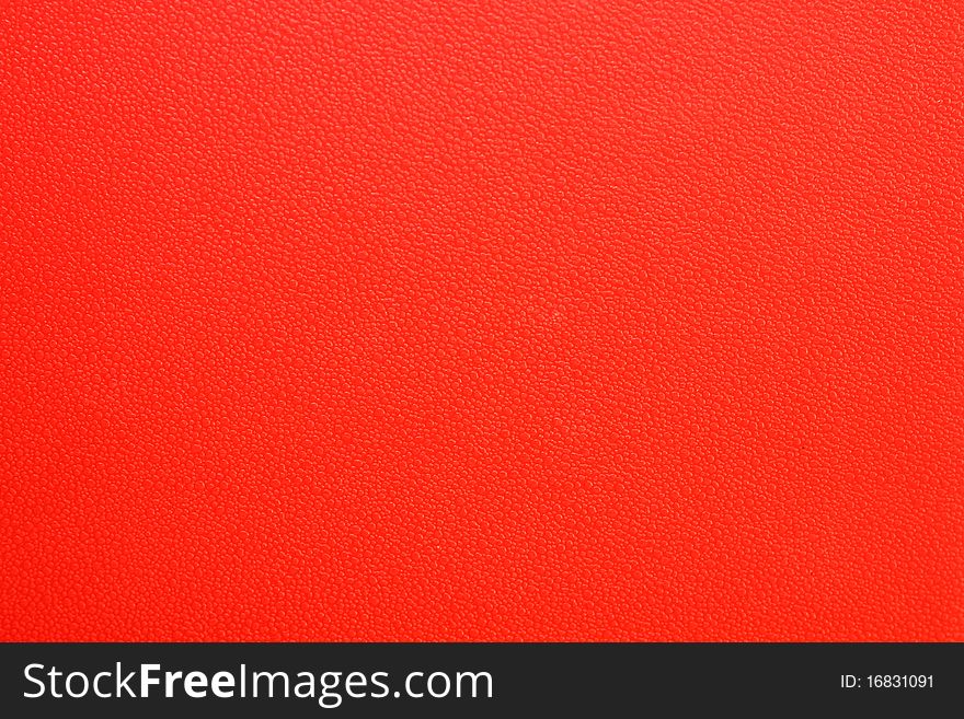 a red plastic surface texture. a red plastic surface texture
