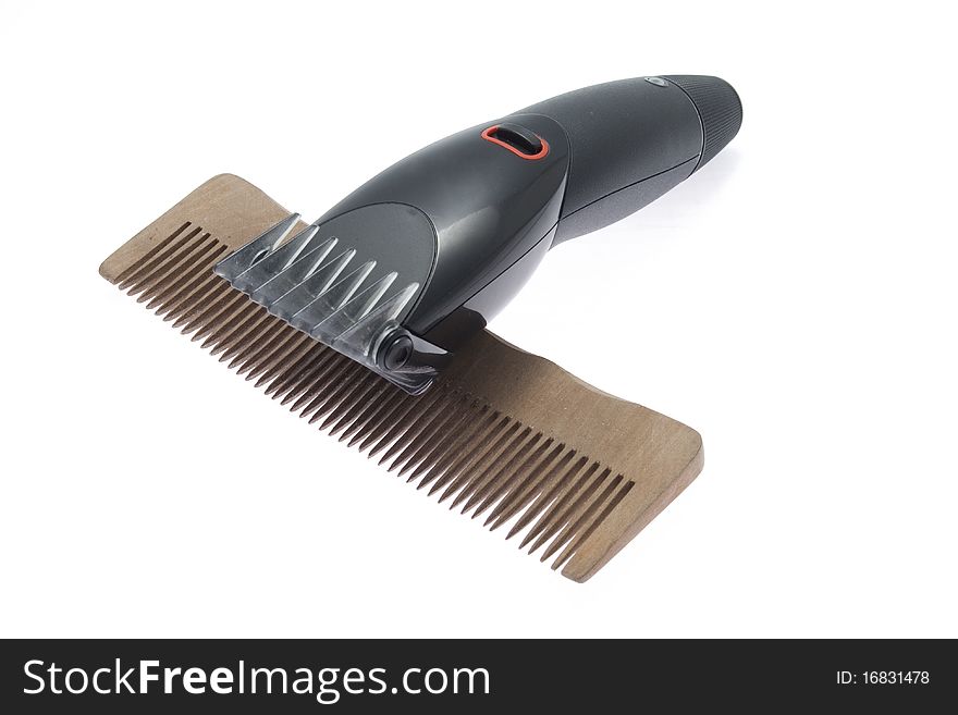 Comb and hairclipper on white