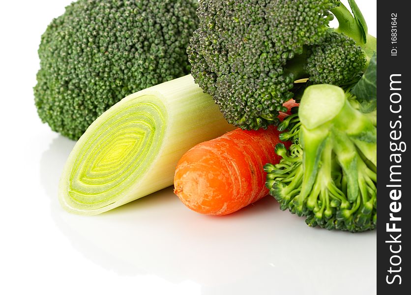 Vegetables on white background. Broccoli, carrot, onion