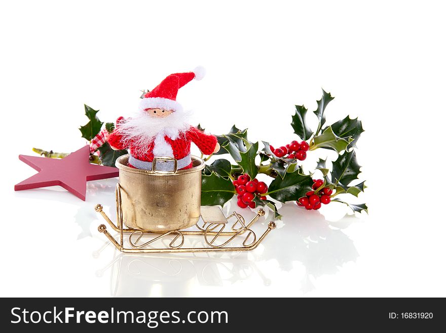 Santa claus in his golden sled isolated over white