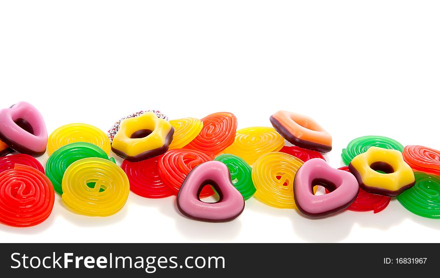 Many sorts of colorful candy isolated over white