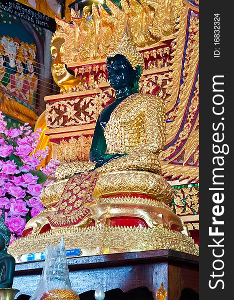 Transparent green Buddha in church at Wat Kaotulian temple, Thailand.