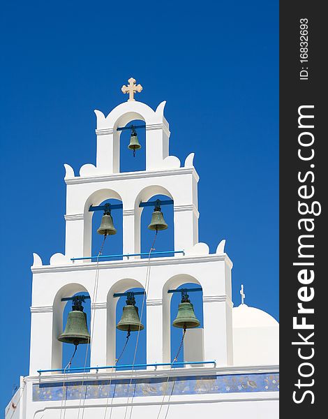 Beautiful white belfry of greek church on island of Santorini in Oia, Greece. Beautiful white belfry of greek church on island of Santorini in Oia, Greece