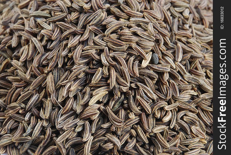 Cumin seeds - close up view, can be used as a background