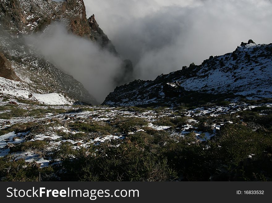 The crater of Taburiente, as seen from above, with clouds forming. The crater of Taburiente, as seen from above, with clouds forming.