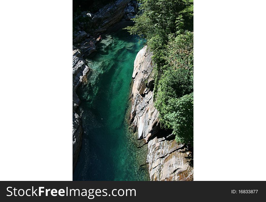 A river in the mountains of Switzerland, the Alps. A river in the mountains of Switzerland, the Alps