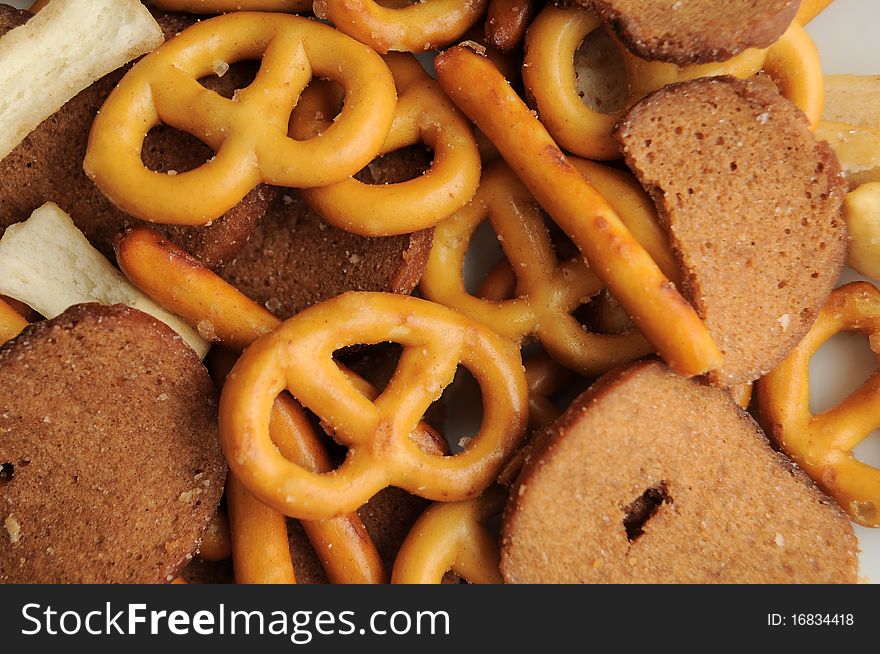 A bunch of pretzels and other breads assorted in a various trail mix. A bunch of pretzels and other breads assorted in a various trail mix.