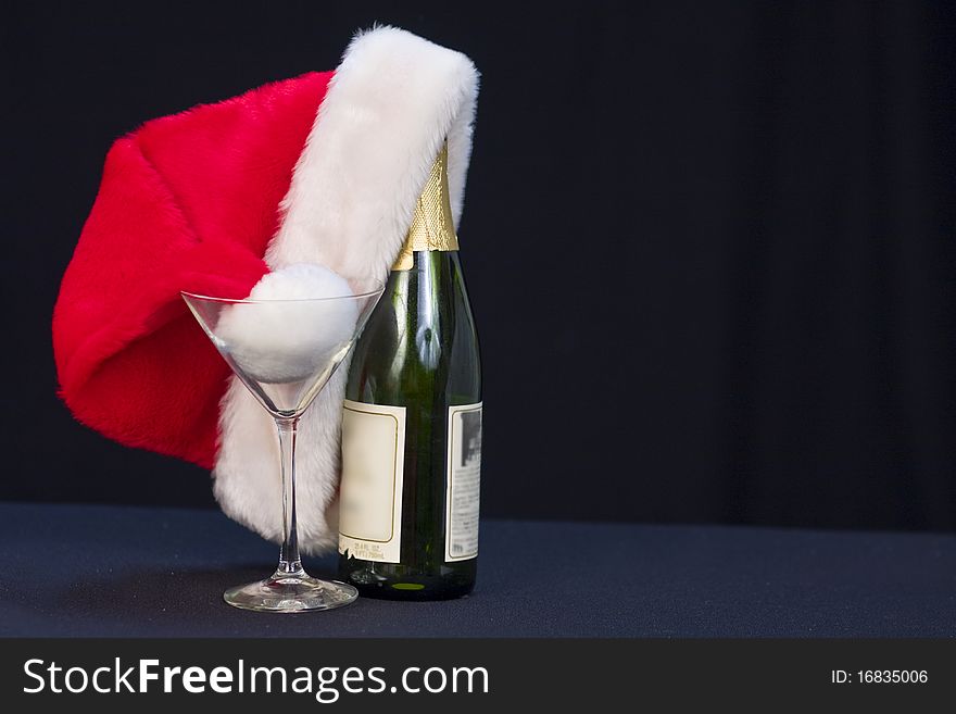 Santa's hat with bottle of wine/champagne. Santa's hat with bottle of wine/champagne