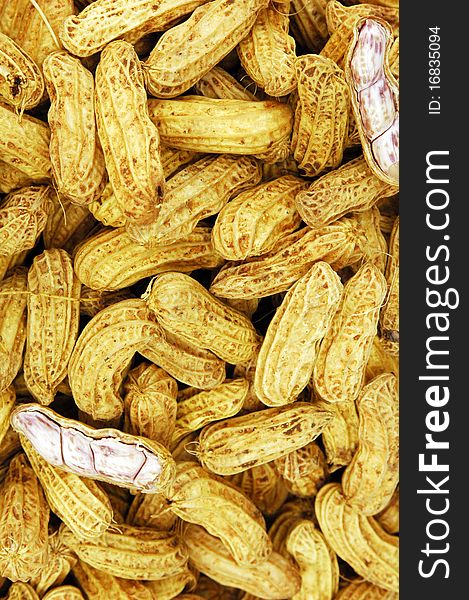 Boiled peanuts are green or raw nuts that are boiled in salty water for hours outdoors over a fire. The shells turn soggy, and the peanuts take on a fresh, legume flavor.