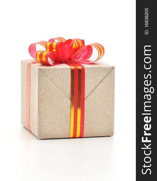 Gift box with gold and red ribbon in white background.