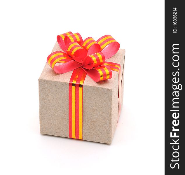 Gift box with gold and red ribbon in white background.