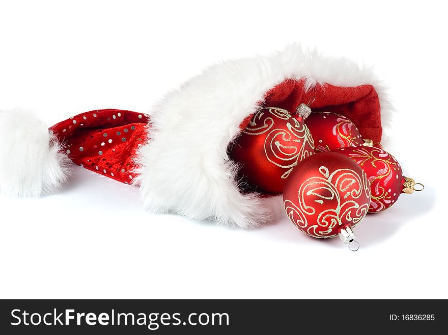 Santa Claus hat with Christmas ornaments isolated on white background