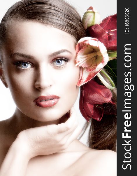 Portrait of beautiful girl with flowers in her hair