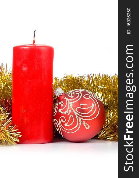 Christmas candle and ornaments isolated on white background