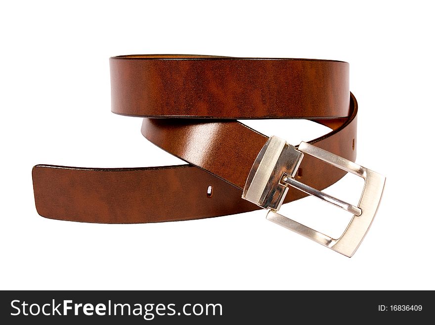 A black leather belt isolated on white background. A black leather belt isolated on white background