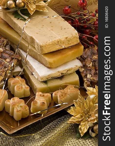 Typical Spanish Christmas nougat in a golden plate