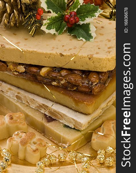 Typical Spanish Christmas nougat in a golden plate