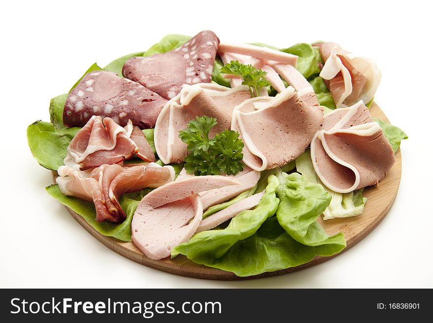 Mixed sausage plate with lettuce leaf