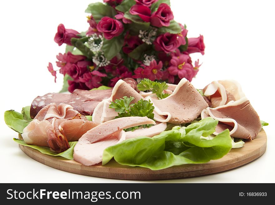 Sausage plate and bunch of flowers