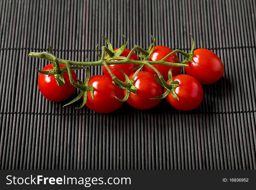 Cherry tomatoes on bamboo rag