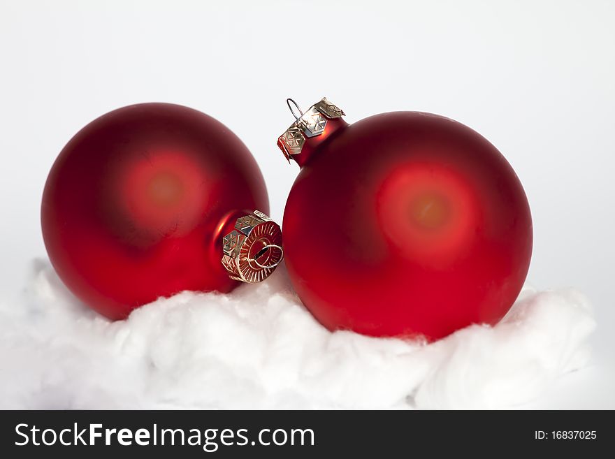 Two Red Chrismas Baubles In The Snow