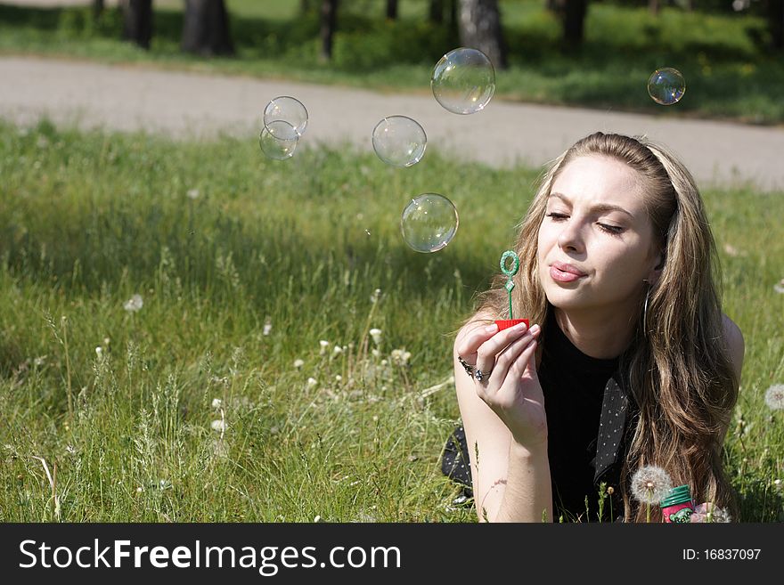 Girl blowing soap bubbles