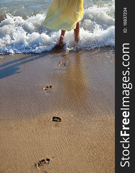 The footprints of a woman on the coast. The footprints of a woman on the coast