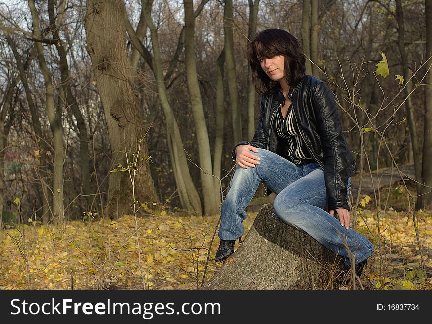 Girl Sitting On A Stump