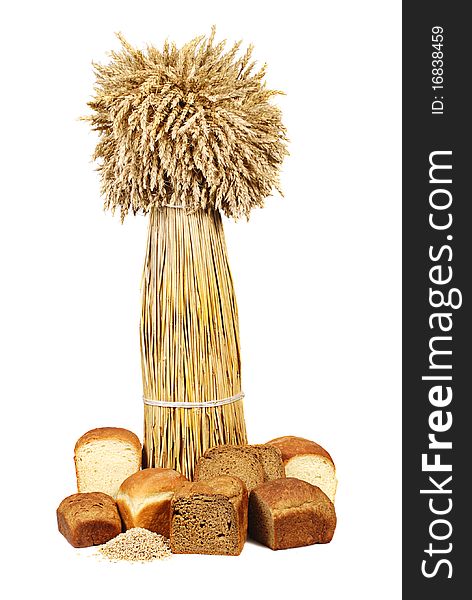 Sheaf of wheat and bread on a white background