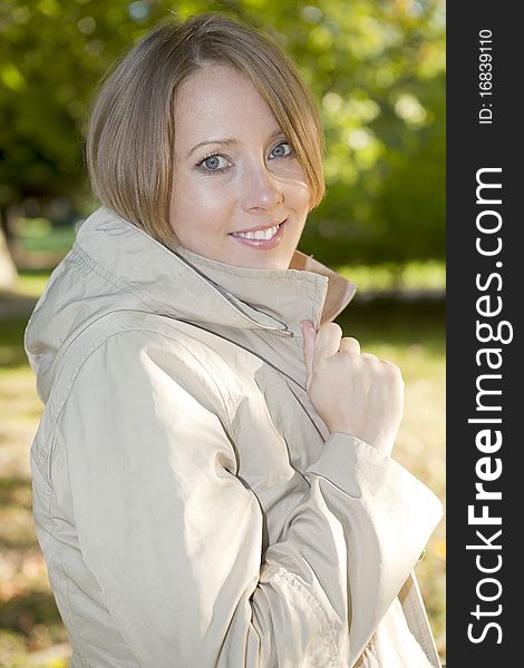 The woman relaxes with the autumn in the park. The woman relaxes with the autumn in the park