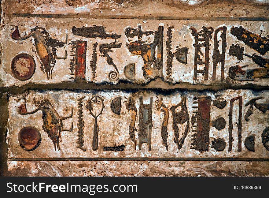 Fresco with Egyptian hieroglyphs between the tops of Column. Karnak Temple Complex