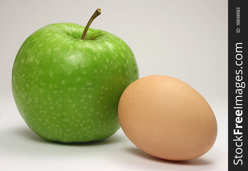 An apple and an egg. An apple and an egg