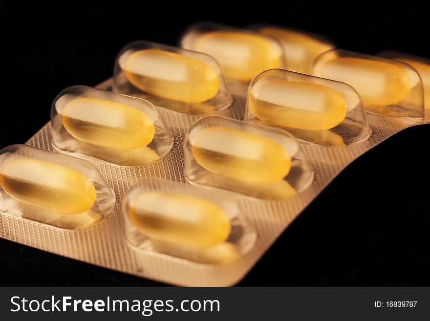 Closeup of tablets isolated on black background