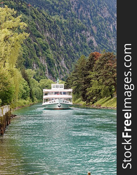 Tourist passenger vessel on Interlaken river Switzerland.