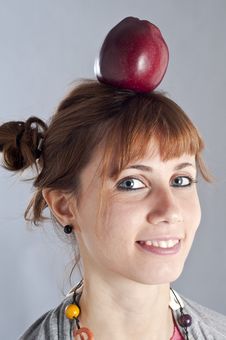 Young Girl With Pigtails And An Apple On Her Head Royalty Free Stock Images Young Girl With Pigtails And An Apple On Her Head Royalty Free Stock Images