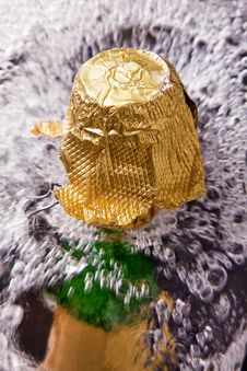 Bottle Of Champagne, Cork And Splashing Royalty Free Stock Photography