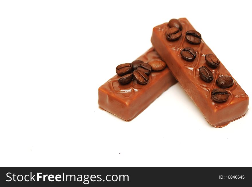 Coffee beans and chocolate on white background. Coffee beans and chocolate on white background