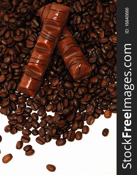 Coffee beans and chocolate on white background. Coffee beans and chocolate on white background