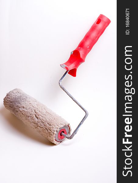 Isolated used paint roller on a white background