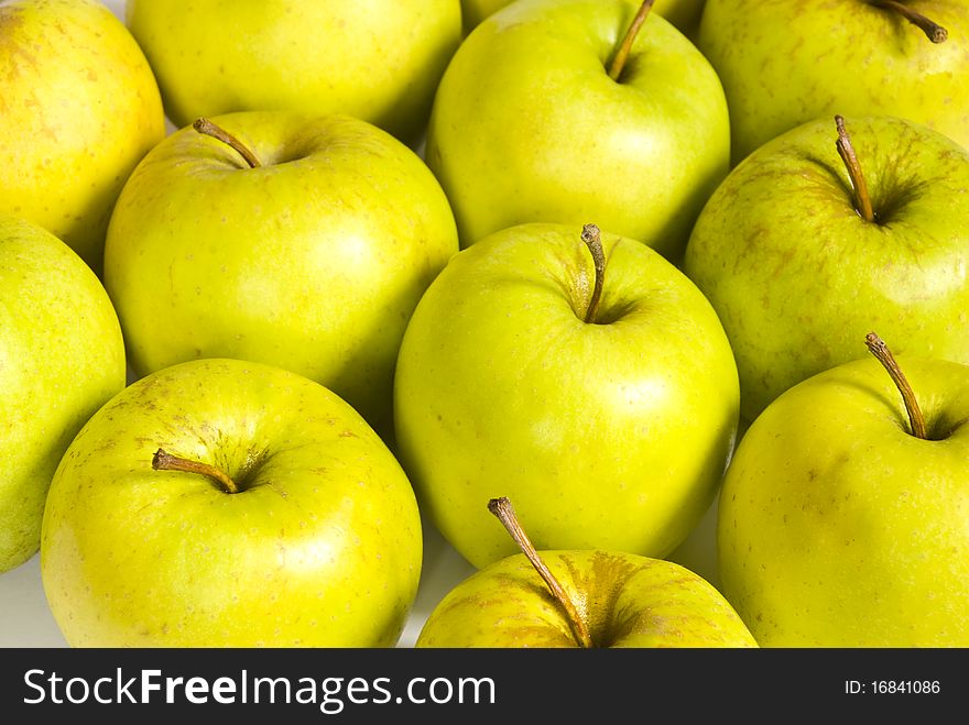 Green apples were piles close to each other