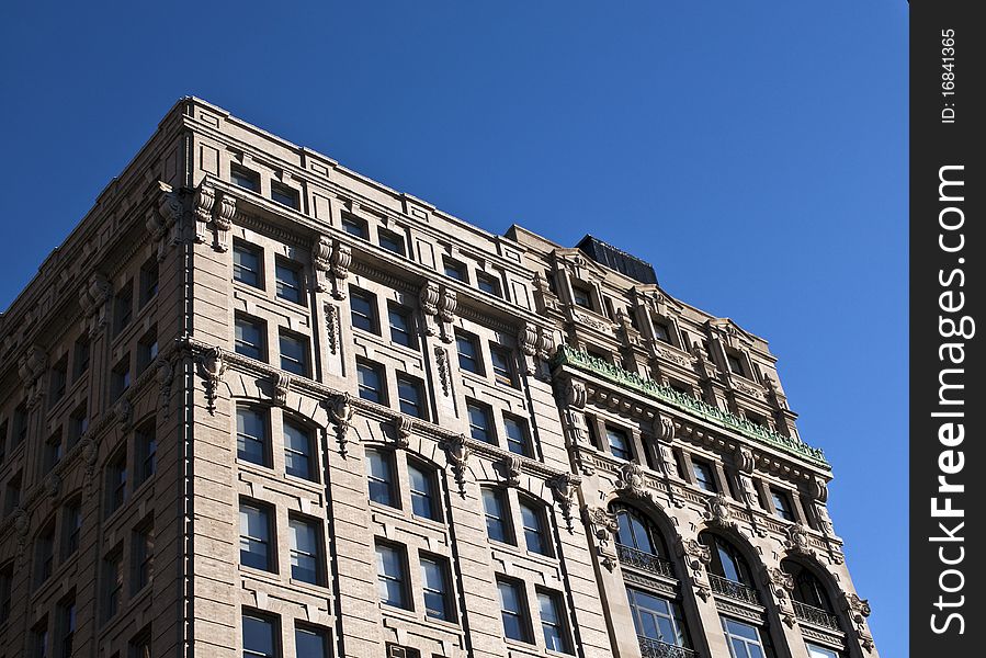 A New York City Brownstone on a clear day with blue sky. A New York City Brownstone on a clear day with blue sky.