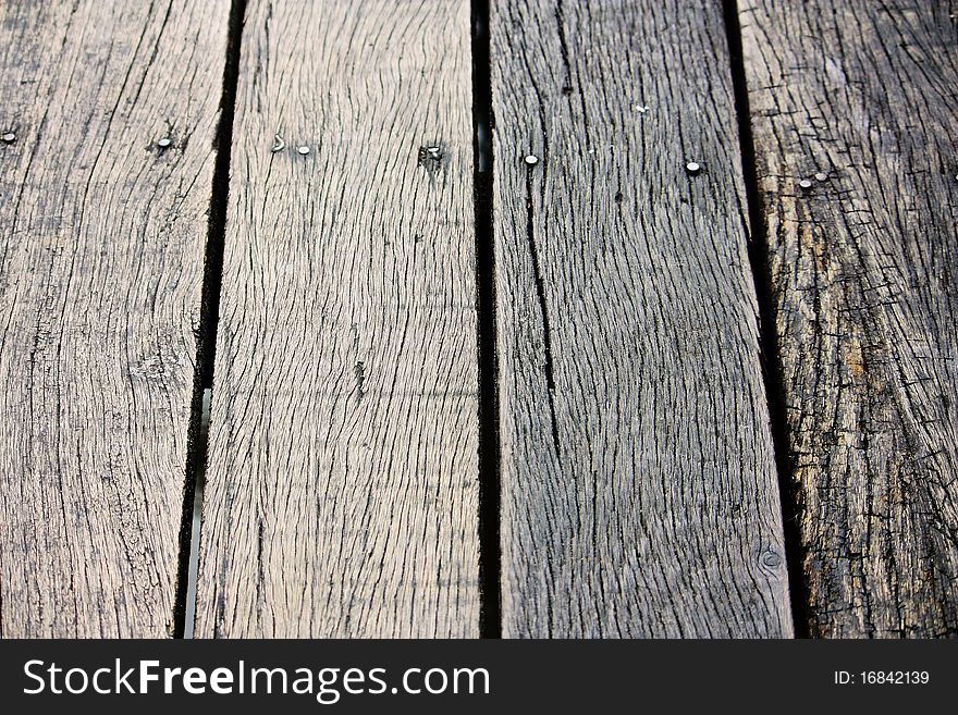 The brown wood texture with natural patterns. The brown wood texture with natural patterns