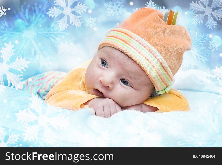 Photo of the little girl in winter snowflakes. Photo of the little girl in winter snowflakes