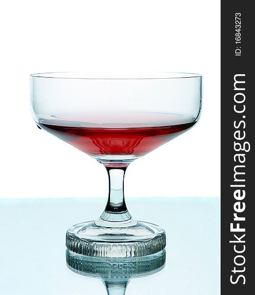 Red wine in glass. Isolated on white background