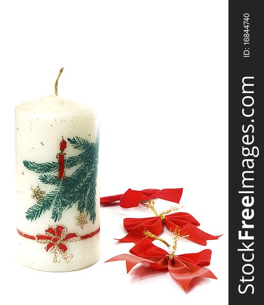 Christmas candle and ribbon isolated on white background