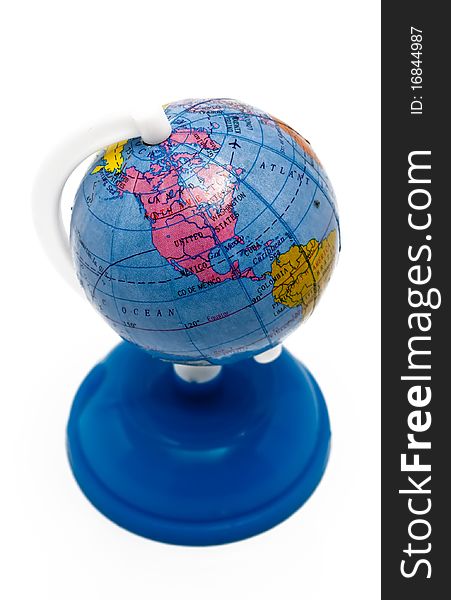 Small globe on a blue stand isolated on a white background. Small globe on a blue stand isolated on a white background